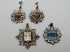 A pair of silver earrings converted from fobs verso engraved Steeplechase Weymouth College,with a