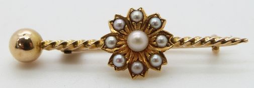 Edwardian gold brooch set with seed pearls in a flower setting, in original box, 3.36g, 4.3 x 1.3cm