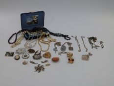 A quantity of costume jewellery including silver cross and chain, silver necklace depicting daisies,