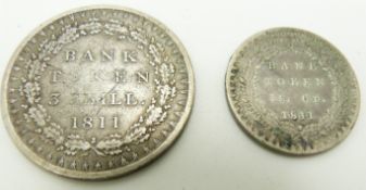 1811 George III Bank of England three shilling token, together with a one shilling and sixpence