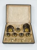 Cased George V Royal Worcester coffee service with six hallmarked silver gilt spoons, London 1921