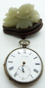A silver pocket watch by S.J.Bartlett and jadeite carving