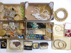 A collection of costume jewellery including gold toned jewellery, white metal pendant, silver