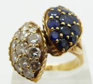 An 18ct gold ring set with diamonds and sapphires in two sections, the largest two stones