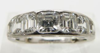 A 1930's Cartier platinum ring set with alternating asscher and emerald cut diamonds, the centre