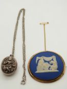 An Indian white metal locket and a Jasperware brooch possibly Wedgwood
