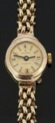 Excalibur 9ct gold ladies wristwatch with black hands, two-tone baton markers, gold dial and 17