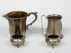A pair of Indian/Burmese white metal salts with embossed decoration of animals in foliage, jug