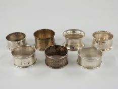 Seven various hallmarked silver napkin rings, 94g
