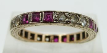 A 9ct gold eternity ring set with square cut rubies and cubic zirconia, size O