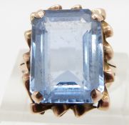 A 9ct gold ring set with an emerald cut blue synthetic spinel , size K
