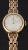 Omega 9ct gold ladies wristwatch ref. 203.069 with gold dauphine hands and baton markers, cream dial