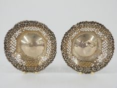 A pair of Victorian hallmarked silver pierced and embossed bonbon dishes, one Chester 1896 maker