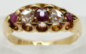 An 18ct gold ring set with rose cut diamonds and three rubies, Chester 1904, size M