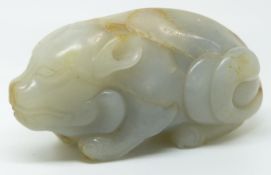 A 19thC carved jade figure of a recumbent pig, height 4cm x length 7.5cm