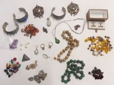 A collection of jewellery including white metal bangles, beads, silver ring, silver pendant, agate