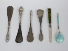 Four various hallmarked silver handled shoe horns, hallmarked silver, mother of pearl and agate page