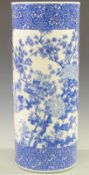 A 19th/20thC Chinese blue and white porcelain stick/umbrella stand decorated with three peonies,