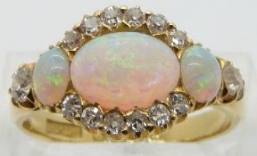 Edwardian 18ct gold ring set with three opal cabochons and diamonds, Birmingham 1904, maker Pepper