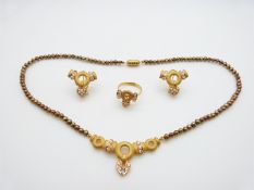 A 22ct gold suite of jewellery comprising earrings, necklace and ring, all set with cubic
