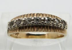 A 9ct gold half eternity ring