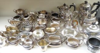 A quantity of silver plated ware including toast racks, wine coaster, bowls, sauce boats, teaware