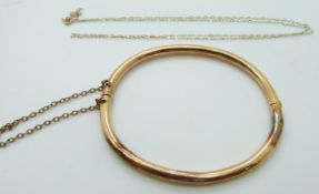 A 15ct gold bangle (6.8g) and a 9ct gold necklace (0.4g)