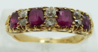 Edwardian 18ct gold ring set with old cut diamonds and oval cut rubies, size K
