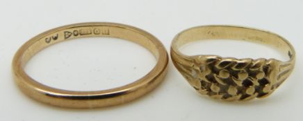 A 9ct gold keeper ring and a 9ct gold wedding ring, 3g