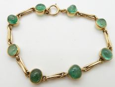 An 18ct gold bracelet set with emerald cabochons, 19.4g