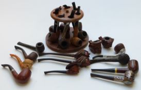 A collection of pipes and pipe stand for seven named days, with pipes including sterling silver