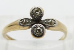 An 18ct gold ring set with diamonds in a platinum setting, size M