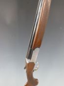 Browning Medalist Sporter 20 bore over and under shotgun with named and engraved locks, chequered
