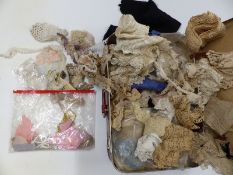 Vintage suitcase of lace trims, collars, doilies etc