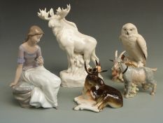 A collection of ceramics to include two Russian / Lomonosov moose figures, a Nao figure of a
