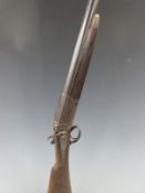 Army & Navy 12 bore single barrel hammer action shotgun with named and engraved lock, chequered grip