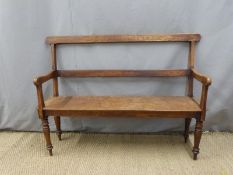 A 19thC oak settle with bevelled upright and frame raised on turned legs W122cm x D38cm x H92cm