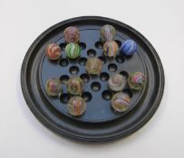 Thirteen handmade glass marbles all with multi-coloured latticino and spiralling decoration, each