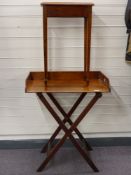 A 19thC mahogany butler's tray on stand and a side table