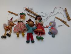 Five Pelham puppets comprising two girls, a boy and two animals