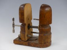 A vintage wooden hat stretcher