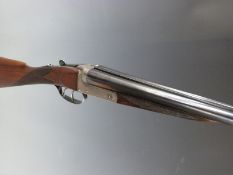 Thomas Wild 12 bore side by side shotgun with named and border engraved locks, chequered grip and