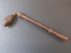 A wooden truncheon, cosh or life preserver with turned handle and ovoid head attached by a leather