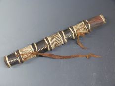 African wooden leather bound arrow quiver with woven rattan decoration and leather strap, 46cm long.
