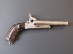 Unnamed side by side pinfire hammer action pistol with carved grip, engraved locks, folding triggers