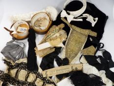 Collection of vintage gentlemen's accessories including collars in a leather box, evening scarf etc