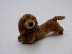 Steiff dachshund dog with shaved mohair, glass eyes, jointed neck and label and button to ear,