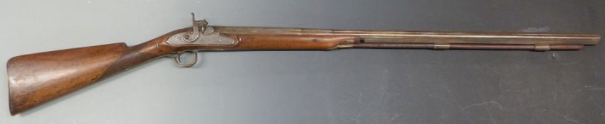 Percussion hammer action gun with engraved lock, trigger guard, top plate and brass pineapple