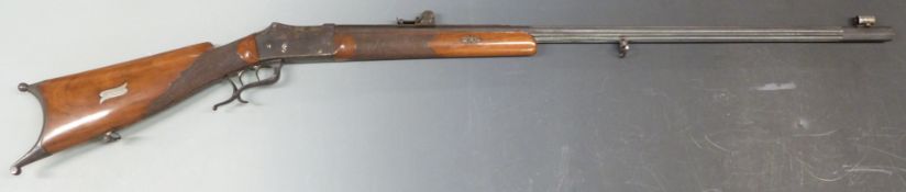 A Muller of Vevey Switzerland 10.4mm Martini action target rifle with chequered grip and forend,