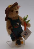 Steiff Teddy bear Gartenfreund with blonde mohair, spade, carrot, dungarees and straw hat, limited